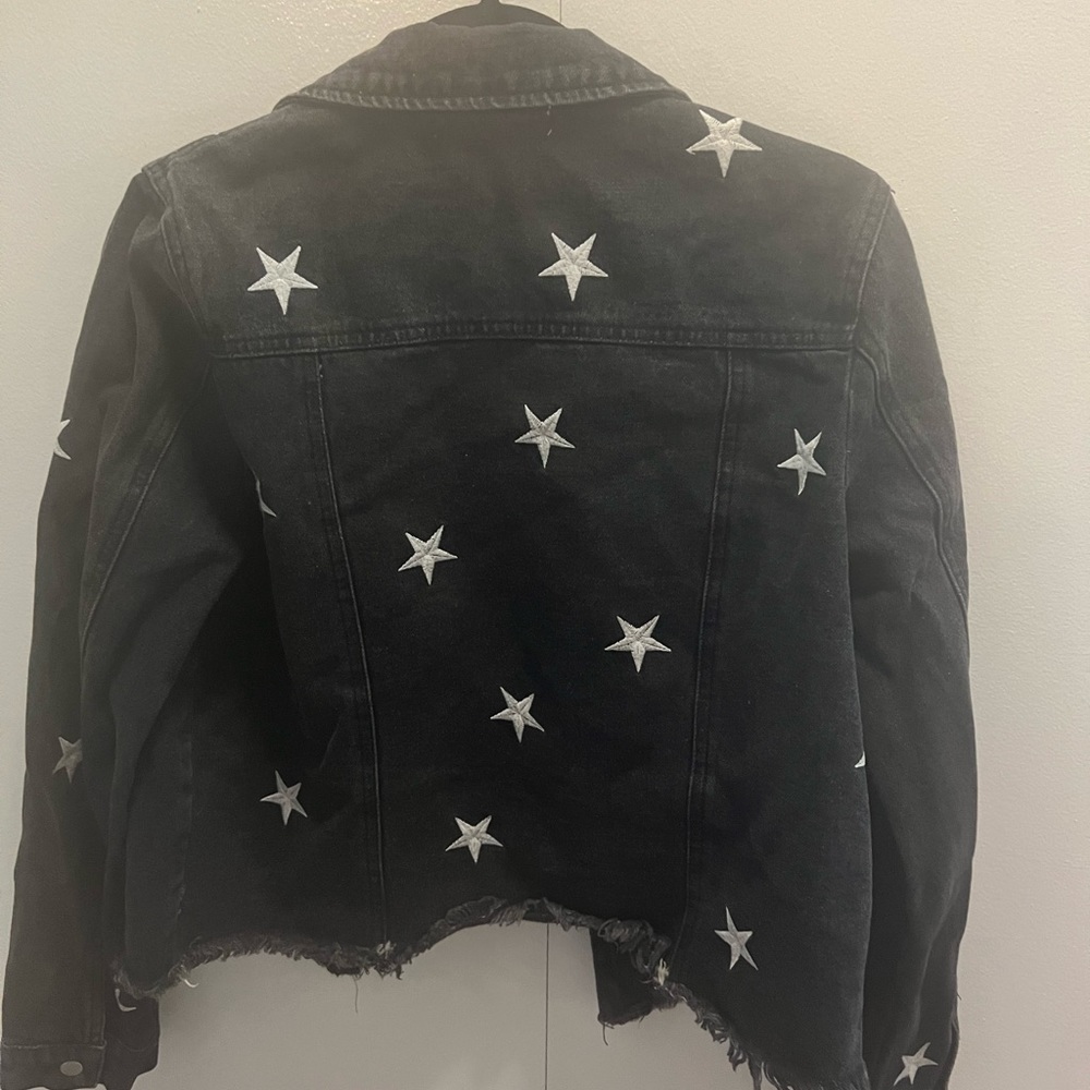 Honeypunch black denim jacket with grey embroidered star detailing. Size M.